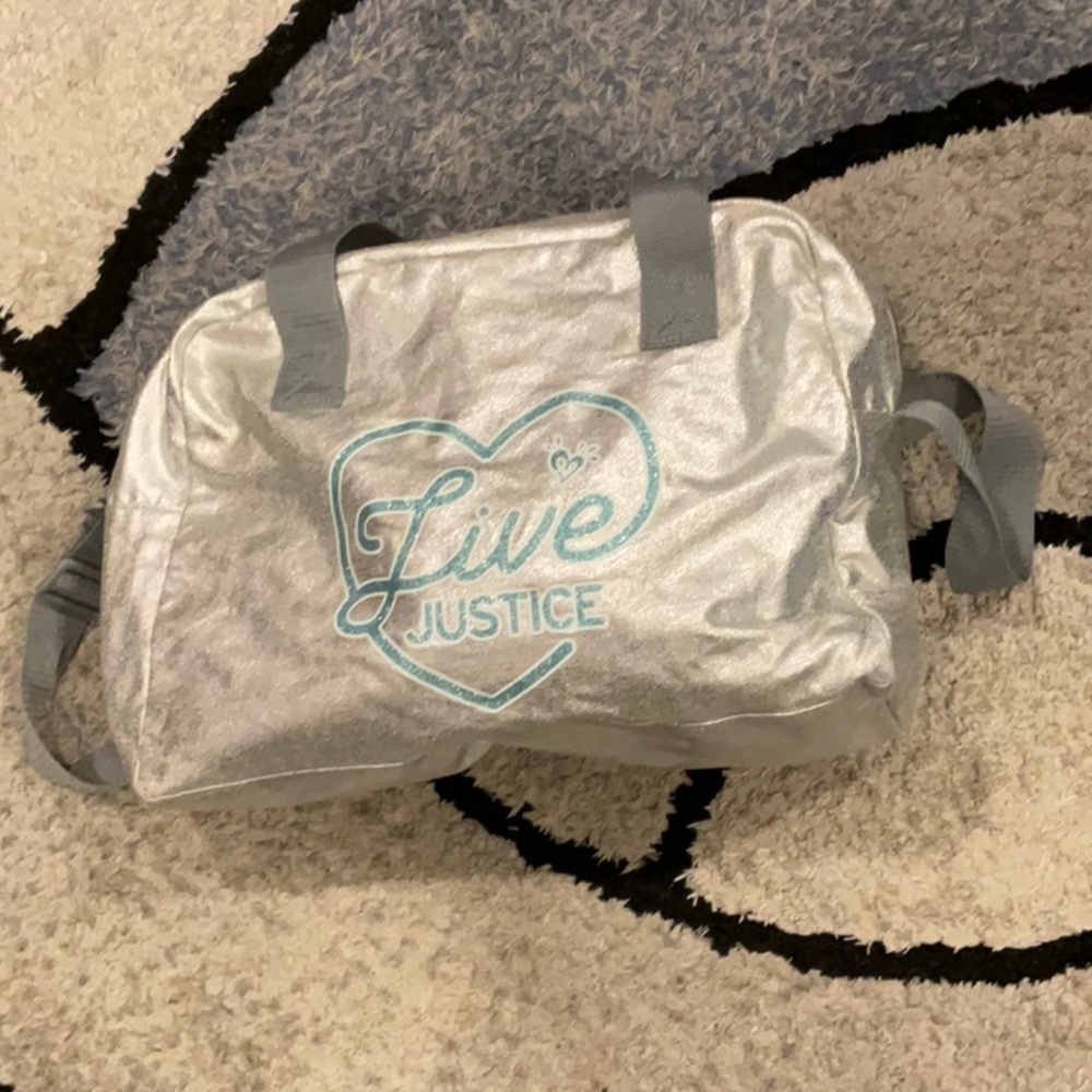 JUSTICE SILVER DUFFLE BAG